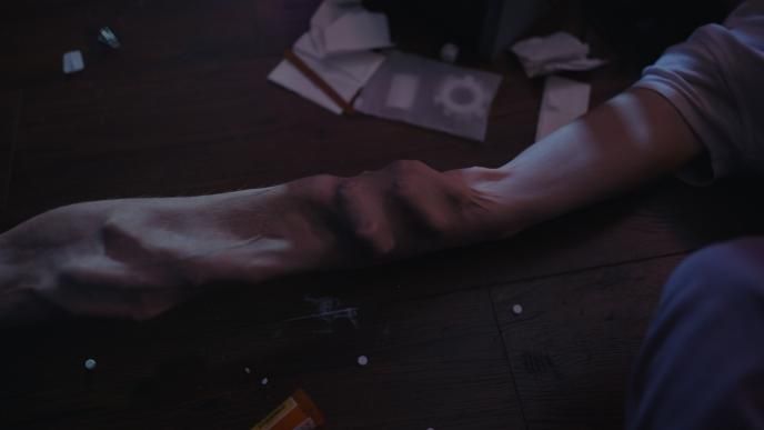 Close up shot of Millie and Tim's arms fusing together - final