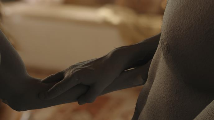 Greyscale layer of Millie & Tim's hands merging 