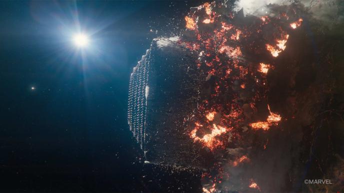 a CGI spaceship bursts through the centre of a planet, causing devastation