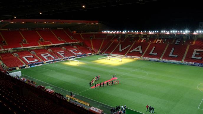 A football pitch lit up at night