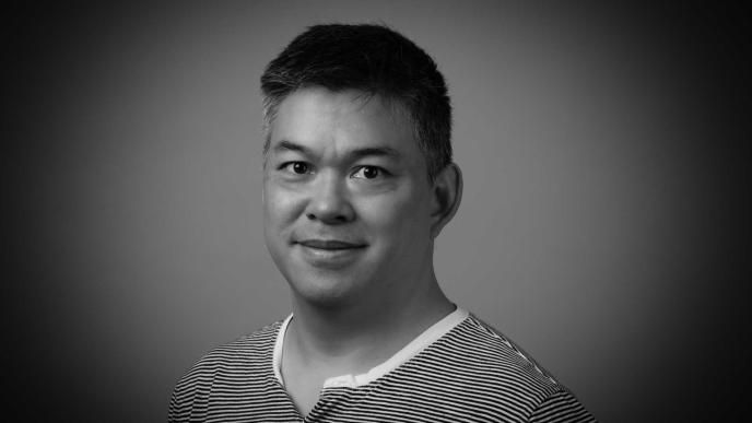 A black and white photo of Kevin Young