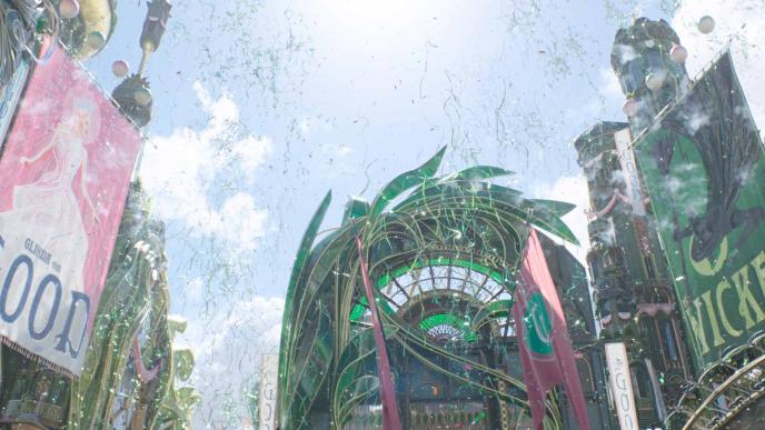 A final shot of the emerald city in Wicked: For Good. Sets are extended with CGI towers, posters, streamers and fireworks.