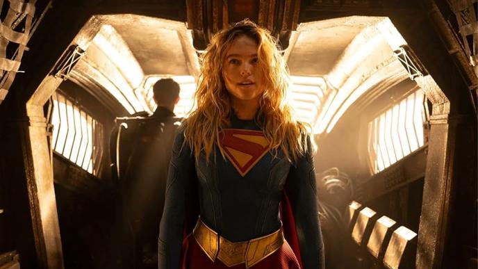 Supergirl on a spaceship, with light flooding in from behind