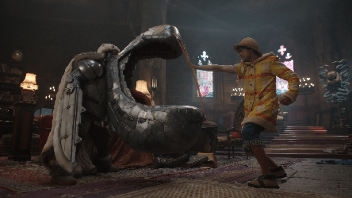 Luffy confronts a towering & armored Tin-Plate Wapol who has a giant metal mouth like weapon.