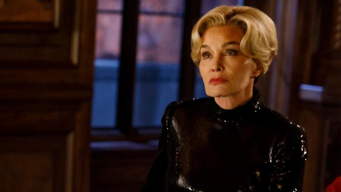 Jessica Lange as Constance Langdon in American Horror Story 13, wearing a shiny black dress