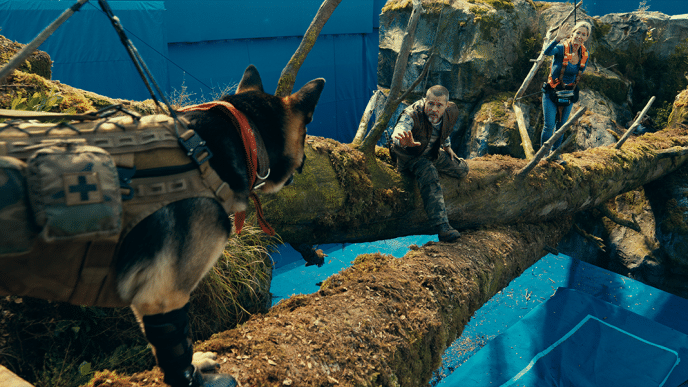 James & Odin crossing a bridge over a rushing river