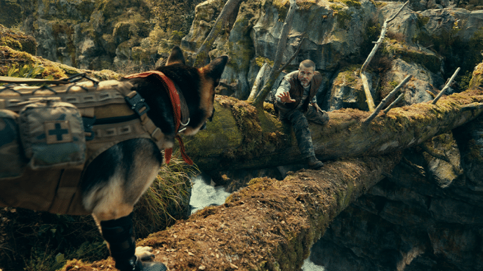 James & Odin crossing a bridge over a rushing river