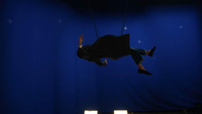 Plate footage of Zendaya as MJ in a wire rig against a blue screen