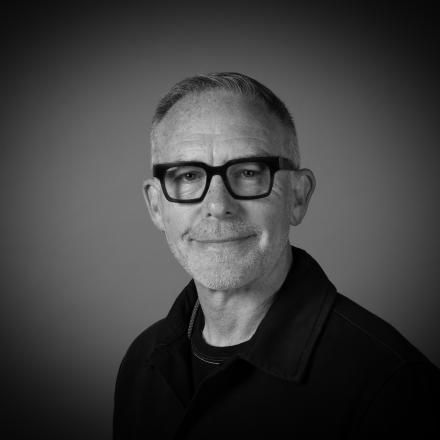 A black and white photograph of Chief Creative Officer Mike McGee