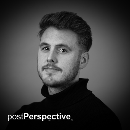 A black and white photograph of Framestore employee Ross Wilkinson against a grey background.
