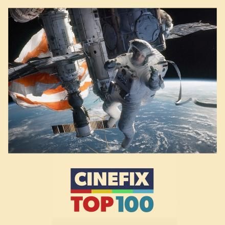 A still from Gravity showing Sandra Bullock in space, with the Cinefix Top 100 logo underneath