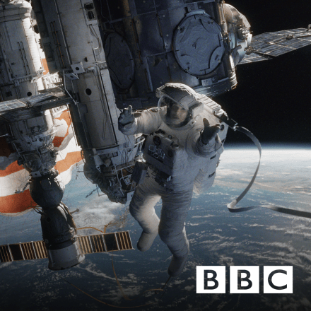 A woman floating in a spacesuit outside of a space station above the earth, there is the BBC logo in the bottom right corner.