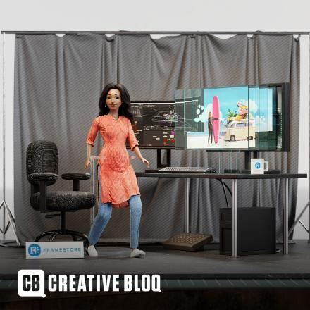 A south asian career doll is working in a VFX lab with grey curtains in the background, a desk and two computer screens. 