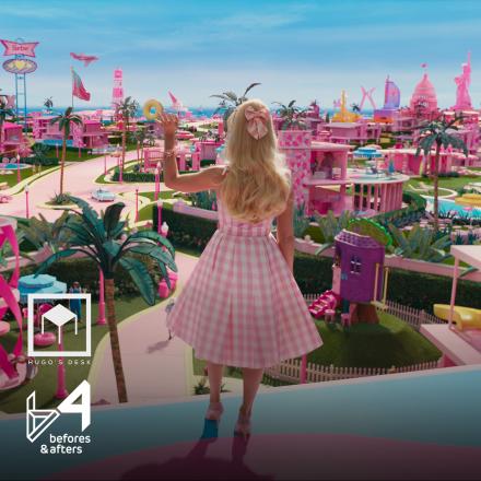 A woman stood looking over a fantastical landscape filled with pink houses and roads, there are two press logos in the bottom left corner.