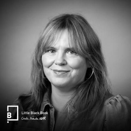 A headshot of Stephanie Bruning in black and white with the LBB logo in the bottom left corner.