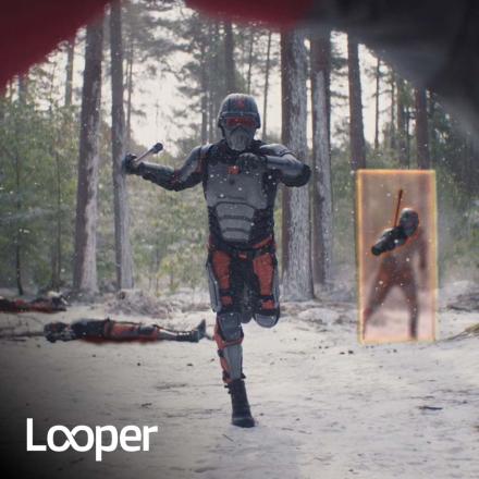 Still from Deadpool and Wolvering film of VFX door with a soldier running through toward camera. Looper logo bottom left