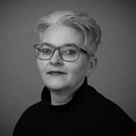 B&W headshot of Lottie Cooper