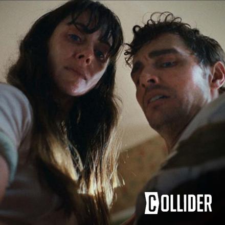 Still from film Together of Alison Brie and James Branco's characters looking down at the camera. Collision Magazine logo bottom right