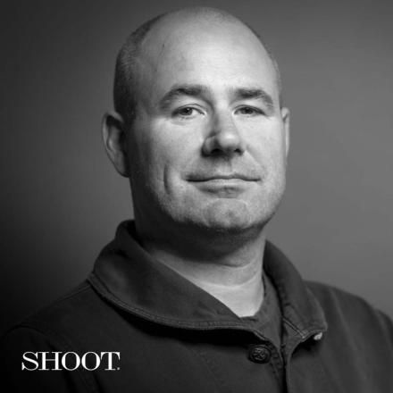 A black and white photo of James Razzall