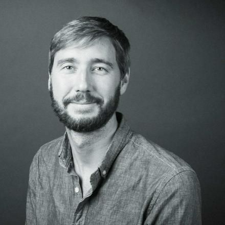 A black and white photo of Theo Jones