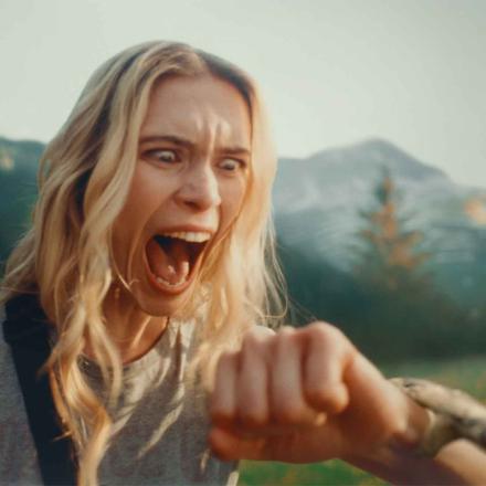 Columbia Sportswear advertisement still of snake biting screaming woman