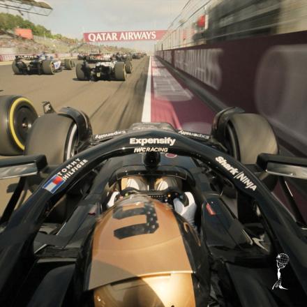 A still from F1: The Movie showing a drivers point of view of a digitally re-skinned formula 1 car.