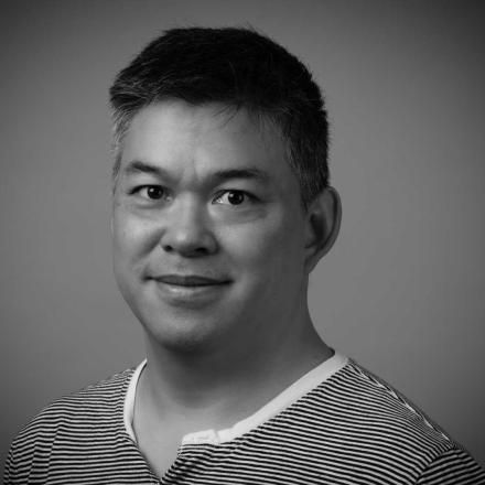 A black and white photo of Kevin Young