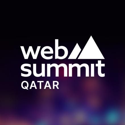 A glowing multicoloured background with a white Web Summit Qatar logo in the centre.