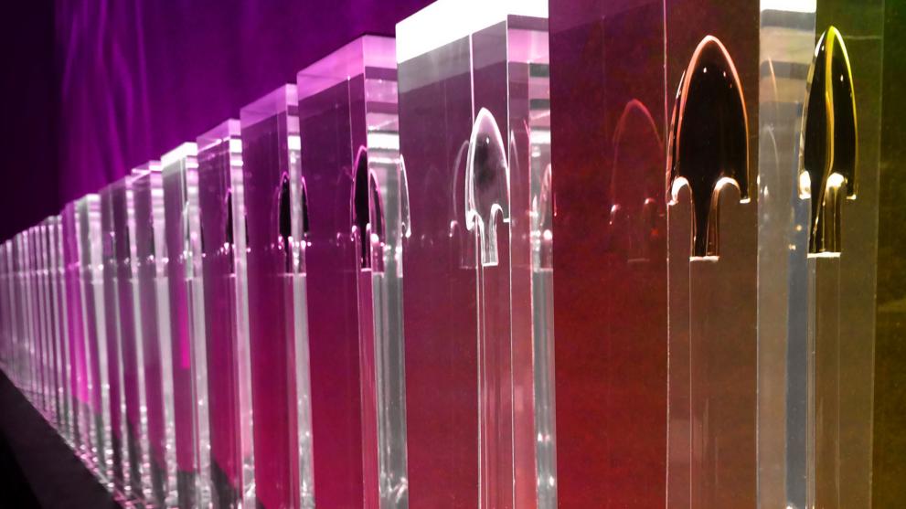 colourful glass pillars that have arrows engraved on the top