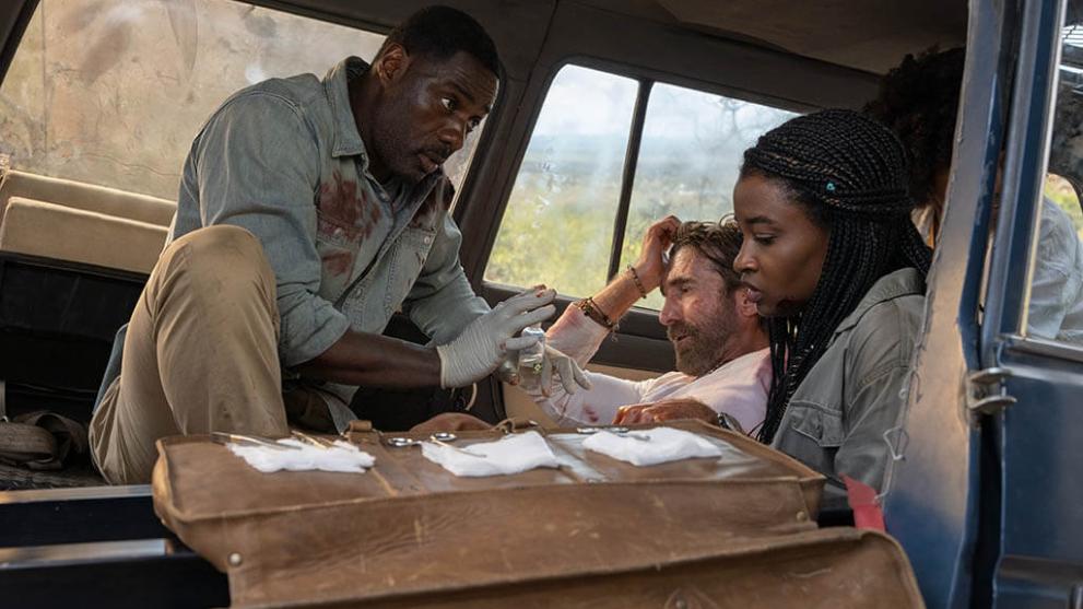 Nathan (Idris Elba), Martin (Sharlto Copley), Mare (Iyana Halley) and Norah (Leah Sava Jeffries) attempt to survive an attack from a rogue lion in Beast, directed by Baltasar Kormákur.