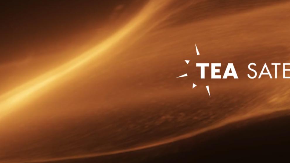 A CG flame and sparks background with a white TEA Inspire on the right hand side.