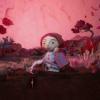 A still from the Womb Stories advert. A woman waters a garden using a watering can.